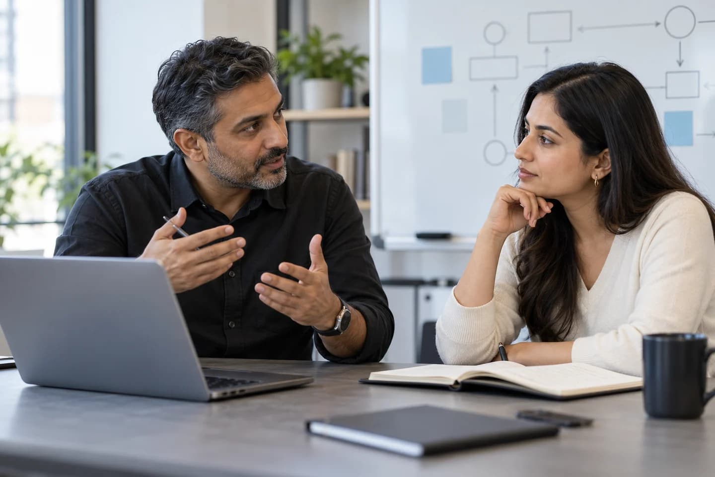 A business consultant sharing his experience in a client conversation